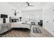 A spacious bedroom featuring a decorative steer skull, black accents, and plantation shutters at 38953 N 57Th Pl, Cave Creek, AZ 85331