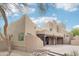 Beautiful home exterior with desert landscaping, an outdoor fireplace and covered patio at 38953 N 57Th Pl, Cave Creek, AZ 85331
