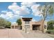 Stunning exterior view of a two-story home with a terracotta tile roof, desert landscaping, and private balcony at 38953 N 57Th Pl, Cave Creek, AZ 85331