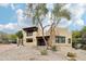 Attractive two-story house with terracotta tile roof, drought-resistant landscaping, and a private courtyard at 38953 N 57Th Pl, Cave Creek, AZ 85331