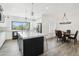Well lit kitchen with white cabinets, large center island, and breakfast nook at 38953 N 57Th Pl, Cave Creek, AZ 85331