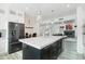 Open concept kitchen with an oversized marble top island looking into an elegant living space at 38953 N 57Th Pl, Cave Creek, AZ 85331
