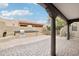 Covered patio with outdoor kitchen, fireplace, and brick pavers at 38953 N 57Th Pl, Cave Creek, AZ 85331