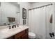 Bathroom with a marble countertop sink, and a shower with white curtain at 3935 E Rough Rider Rd # 1252, Phoenix, AZ 85050