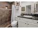 Bathroom featuring a tiled walk-in shower and vanity with granite counters at 3935 E Rough Rider Rd # 1252, Phoenix, AZ 85050