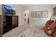 Bedroom with decorative artwork, a TV, and comfortable furnishings at 3935 E Rough Rider Rd # 1252, Phoenix, AZ 85050