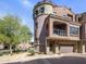 Elegant Mediterranean-style townhome featuring a private balcony and a two-car garage at 3935 E Rough Rider Rd # 1252, Phoenix, AZ 85050