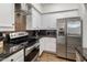 Well-equipped kitchen with stainless steel appliances and sleek cabinetry at 3935 E Rough Rider Rd # 1252, Phoenix, AZ 85050