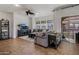 Open living space with tile flooring and bright light from sliding glass doors to balcony at 3935 E Rough Rider Rd # 1252, Phoenix, AZ 85050