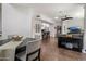 Open-concept living and dining area featuring tile floors and modern decor at 3935 E Rough Rider Rd # 1252, Phoenix, AZ 85050