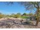 Community park with grassy area, walking path, desert landscaping, and a gazebo at 3935 E Rough Rider Rd # 1252, Phoenix, AZ 85050