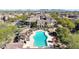 Aerial view of the community pool featuring lounge chairs and lush landscaping at 3935 E Rough Rider Rd # 1252, Phoenix, AZ 85050