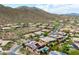 Stunning aerial view of neighborhood homes with solar panels, landscaping, mountain views, and desert landscape at 42037 N Bradon Way, Phoenix, AZ 85086