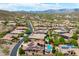 Stunning aerial view of neighborhood homes with solar panels, landscaping, and desert mountain views at 42037 N Bradon Way, Phoenix, AZ 85086