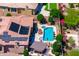 Aerial view of private backyard with swimming pool, spa, patio seating, lush landscaping at 42037 N Bradon Way, Phoenix, AZ 85086