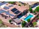 Aerial view of a private backyard featuring a swimming pool, spa, patio seating, and lush landscaping at 42037 N Bradon Way, Phoenix, AZ 85086