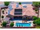 Aerial view of a private backyard oasis featuring pool, spa, covered patio, lounge chairs, landscaping at 42037 N Bradon Way, Phoenix, AZ 85086