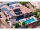 Aerial view of backyard with swimming pool, spa, covered patio, outdoor seating, with desert landscape at 42037 N Bradon Way, Phoenix, AZ 85086