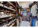 Custom closet shelving, shoe storage, and garment hanging rods create space at 42037 N Bradon Way, Phoenix, AZ 85086