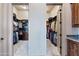 Spacious -and- walk-in closet with custom shelving and ample storage space at 42037 N Bradon Way, Phoenix, AZ 85086