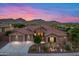 Stunning exterior of the home with well manicured landscaping and a three car garage at 42037 N Bradon Way, Phoenix, AZ 85086