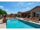 Backyard pool with a spa, lounge chairs and outdoor seating area, perfect for relaxing and enjoying the outdoors at 42037 N Bradon Way, Phoenix, AZ 85086