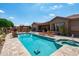 Beautiful backyard pool and patio with lounge chairs and an outdoor seating area, perfect for enjoying sunny days at 42037 N Bradon Way, Phoenix, AZ 85086