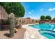 Resort-style pool with desert landscaping, a spa, a stone fire pit and lounge area perfect for entertaining at 42037 N Bradon Way, Phoenix, AZ 85086