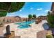Beautiful pool and spa area with barbecue, pergola and mature trees for a relaxing outdoor living experience at 42037 N Bradon Way, Phoenix, AZ 85086