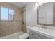 Nicely renovated bathroom features a shower with tile surround, and updated vanity at 4206 N 38Th St # 1, Phoenix, AZ 85018