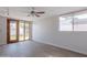 Bright bedroom with wood-look floors, neutral walls, and outdoor access to the backyard at 4206 N 38Th St # 1, Phoenix, AZ 85018