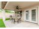 Relaxing covered patio with a ceiling fan, complete with a table, chairs, and grill at 4292 E Terrace Ave, Gilbert, AZ 85234