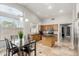 Bright open kitchen with a large island, stone countertops, stainless appliances, and tile flooring at 4292 E Terrace Ave, Gilbert, AZ 85234