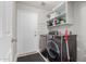 Well-equipped laundry room with modern washer and dryer, ample shelving, and convenient storage solutions at 4292 E Terrace Ave, Gilbert, AZ 85234