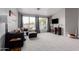 Comfortable living room featuring plush seating, large windows with modern drapery, and contemporary decor at 4292 E Terrace Ave, Gilbert, AZ 85234