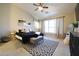 Inviting main bedroom featuring a cozy bed, ceiling fan, and carpet at 4292 E Terrace Ave, Gilbert, AZ 85234