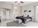 Serene primary bedroom with modern decor, a cozy rug, and an en-suite bathroom entrance at 4292 E Terrace Ave, Gilbert, AZ 85234