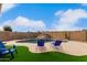 Beautiful backyard with a sparkling pool, artificial grass, and lounge chairs for relaxing at 4292 E Terrace Ave, Gilbert, AZ 85234