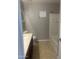 Neutral bathroom featuring a shower-tub combo and a vanity with a light countertop at 43845 W Elizabeth Ave, Maricopa, AZ 85138
