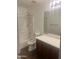 Clean bathroom with neutral walls, a single vanity, and a shower-tub combo at 43845 W Elizabeth Ave, Maricopa, AZ 85138