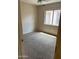 Cozy bedroom with carpet and a window at 43845 W Elizabeth Ave, Maricopa, AZ 85138