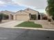 Charming single-story home featuring a well-maintained front yard and attached two-car garage at 43845 W Elizabeth Ave, Maricopa, AZ 85138