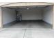 Spacious two-car garage with an included water heater and water softener at 43845 W Elizabeth Ave, Maricopa, AZ 85138