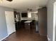 Lovely kitchen with an island and an adjoining dining room at 43845 W Elizabeth Ave, Maricopa, AZ 85138