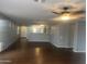 Beautifully designed living room with wood floors at 43845 W Elizabeth Ave, Maricopa, AZ 85138