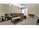 Comfortable living room featuring tile floors, a ceiling fan, and sliding glass doors to the outside at 4549 W Mclellan Rd, Glendale, AZ 85301