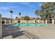 Community pool surrounded by a black fence, providing a refreshing amenity for residents at 4549 W Mclellan Rd, Glendale, AZ 85301