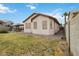 Spacious backyard with a patio and well-maintained landscaping, perfect for outdoor enjoyment at 46185 W Dutchman Dr, Maricopa, AZ 85139