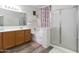 Elegant bathroom featuring double vanity, soaking tub, and separate glass shower at 46185 W Dutchman Dr, Maricopa, AZ 85139