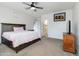 Bedroom featuring comfortable furnishings, a ceiling fan, and carpeted floors for added comfort at 46185 W Dutchman Dr, Maricopa, AZ 85139